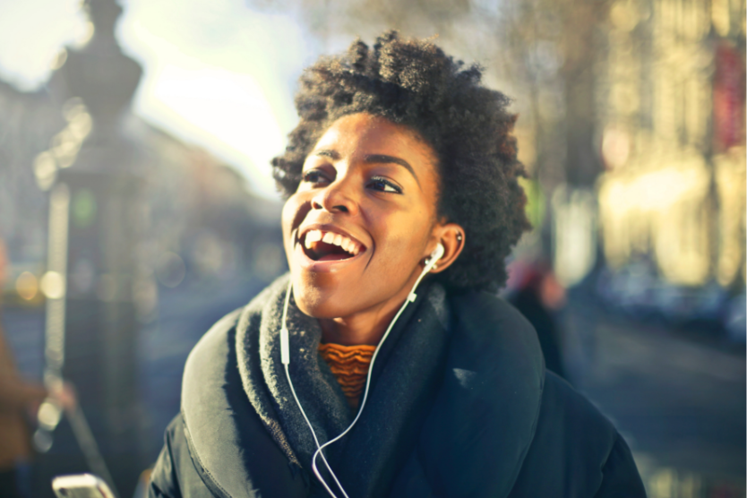 Woman listening to music in sunshine